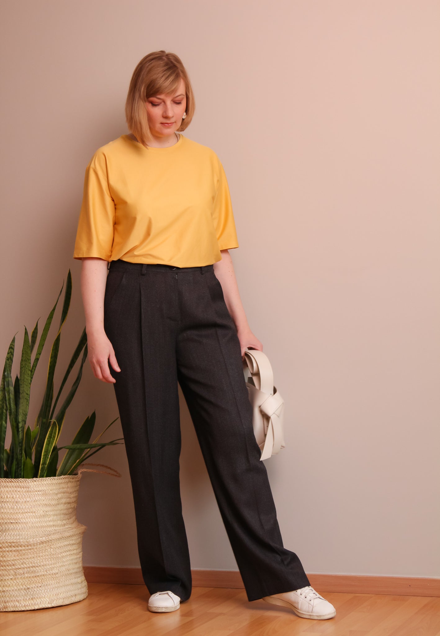 Woman wearing the Stas Trousers sewing pattern from Lenaline Patterns on The Fold Line. A trousers pattern made in twill, cotton gabardine, velvet, flannel, linen, viscose, tencel, wool or denim fabrics, featuring a straight wide silhouette, front pleats,
