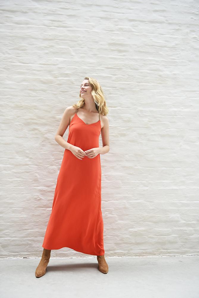 Women wearing the Summer Dress sewing pattern from Fibre Mood on The Fold Line. A slip dress pattern made in satin, linen, viscose, polyester or silk fabrics, featuring spaghetti straps with a cross over option at the back, V-neck and maxi length.