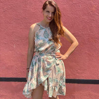 Woman wearing the Summer Dress sewing pattern from You Made My Day Patterns on The Fold Line. A dress pattern made in tencel, viscose, double gauze or cotton fabrics, featuring a bare back, cross over skirt front, ruffles, elasticated waistband, narrow sh