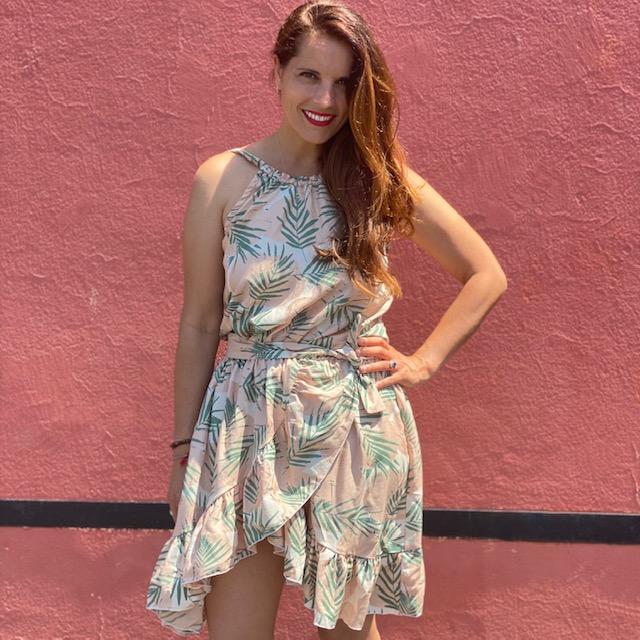 Woman wearing the Summer Dress sewing pattern from You Made My Day Patterns on The Fold Line. A dress pattern made in tencel, viscose, double gauze or cotton fabrics, featuring a bare back, cross over skirt front, ruffles, elasticated waistband, narrow sh