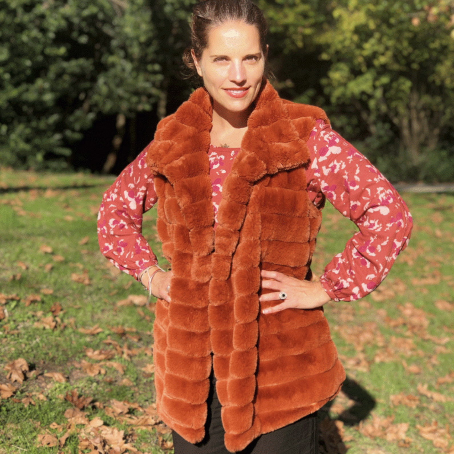 Woman wearing the Sweet Winter Vest sewing pattern from You Made My Day on The Fold Line. A vest pattern made in faux fur, faux leather, cotton, or jacquard fabrics, featuring a mid-length, lined, high collar, and in-seam pockets.