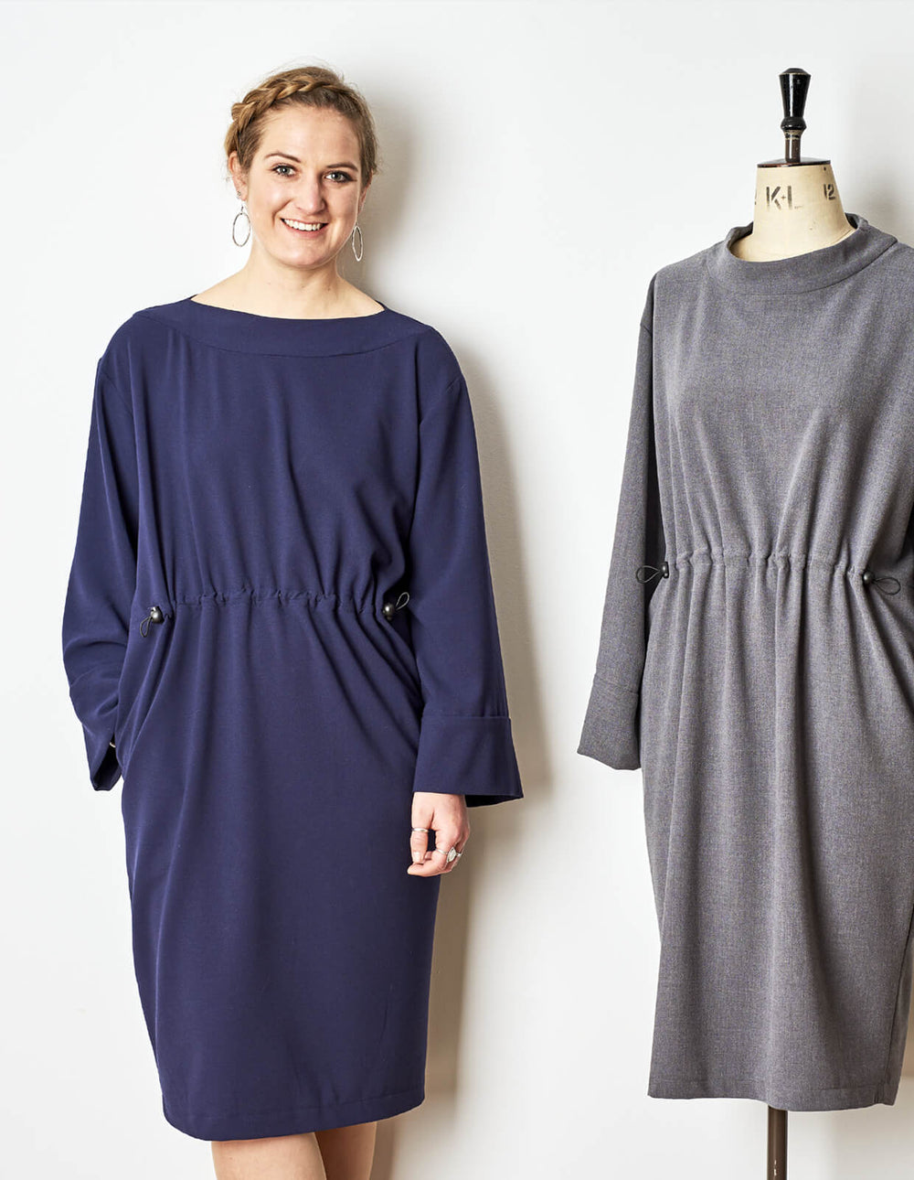 Woman wearing the Relaxed Drawstring Dress sewing pattern from The Maker's Atelier on The Fold Line. A dress pattern made in light to medium weight fluid woven fabrics, featuring a relaxed fit, long sleeves, drawstring waist, full length wide sleeves with