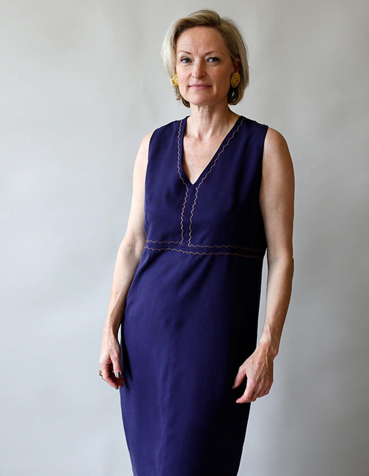 Woman wearing the Slip Dress sewing pattern from The Maker's Atelier on The Fold Line. A slip dress pattern made in tencel, viscose, silks, cottons, or linens fabrics, featuring a pull-on style, V-neck, sleeveless, vertical bust darts, and raised waist se