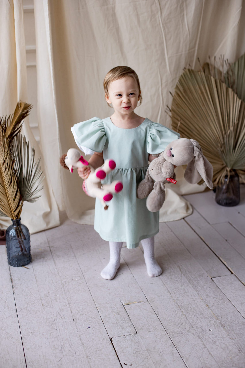 Child wearing the Children’s Tania Dress sewing pattern from Kate’s Sewing Patterns on The Fold Line. A dress pattern made in cotton or linen fabrics, featuring double shoulder ruffles, gathered skirt, lined bodice and round neckline.