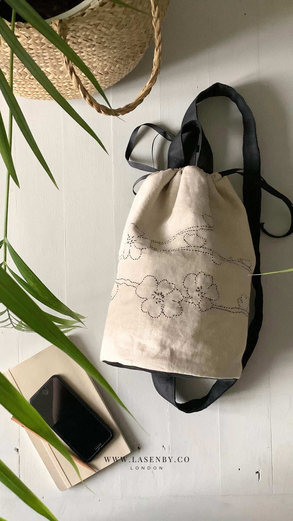 Photo showing the Taru Sakura Crossbody Duffle Bag sewing pattern from Lasenby on The Fold Line. A duffle bag pattern made in canvas, linen, quilting cotton, twill, duck, denim, fine tweed, and Tana lawn fabrics, featuring a sashiko hand embroidery design