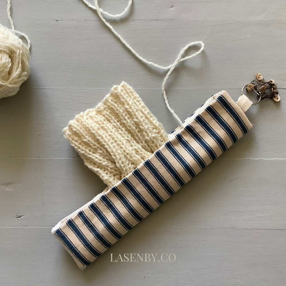 Photo showing the Free Teasel Knitting Pouch sewing pattern from Lasenby on The Fold Line. A knitting pouch pattern made in Tana lawn, cotton, linen, bamboo, quilting cotton, twill, canvas, and drill fabrics, featuring a pouch for double-pointed needles, 