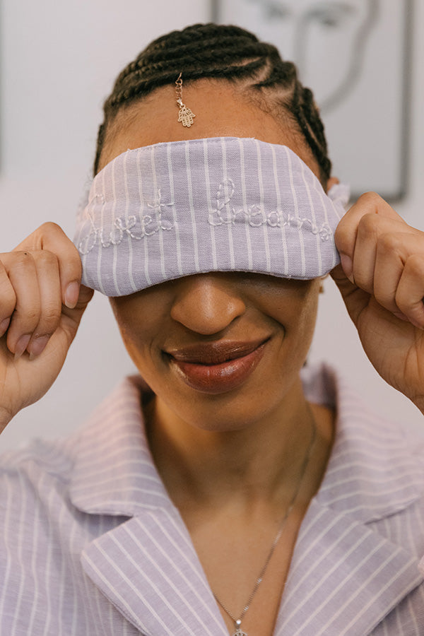 Woman wearing the Aurora Sleep Mask sewing pattern from JULIANA MARTEJEVS on The Fold Line. A sleep mask pattern made in cotton fabric, featuring a soft elastic band.