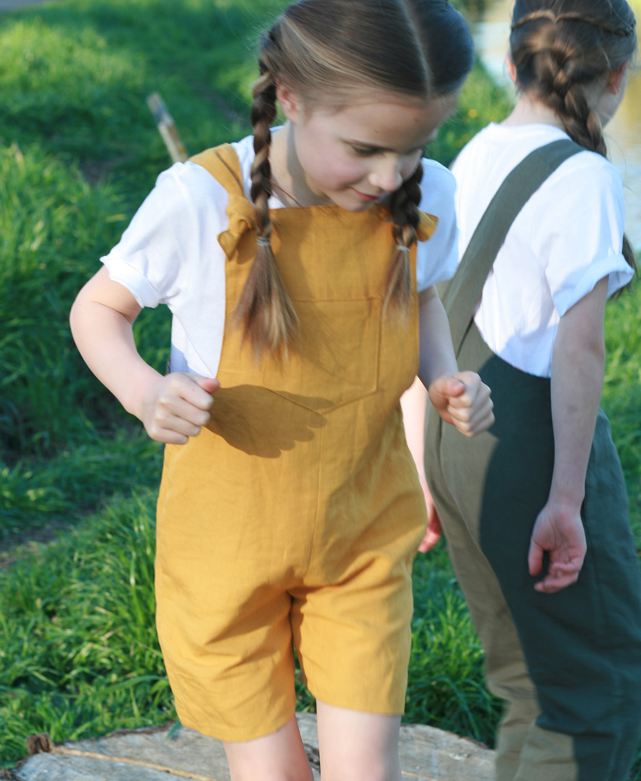 Below the Kōwhai Baby/Child Tipa Dungarees