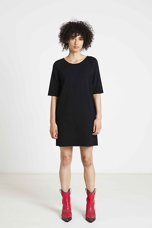 Women wearing the Toni Dress sewing pattern from Fibre Mood on The Fold Line. A dress pattern made in knit or jersey fabrics, featuring a relaxed fit, straight silhouette, above knee length finish, round neckline, elbow length sleeves and in-seam pockets.