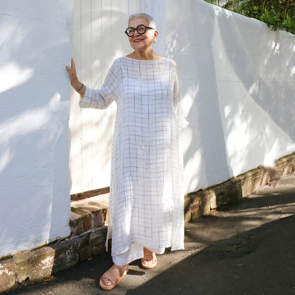 Woman wearing the Tosca Tunic sewing pattern from Tessuti Fabrics on The Fold Line. A tunic pattern made in lightweight linen, crinkle linen, viscose or georgette fabrics featuring a relaxed fit, wide bound neckline, drop shoulders, deep armholes, bracele