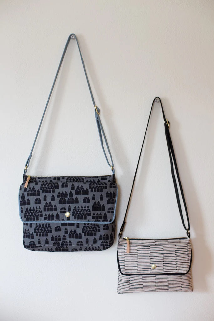 Photo showing the Traverse Bag sewing pattern from Noodlehead on The Fold Line. A cross body bag pattern made in cotton canvas, cotton/linen canvas, twill or hone dec fabrics, featuring a zipped top main compartment, back zippered pocket, front pocket wit
