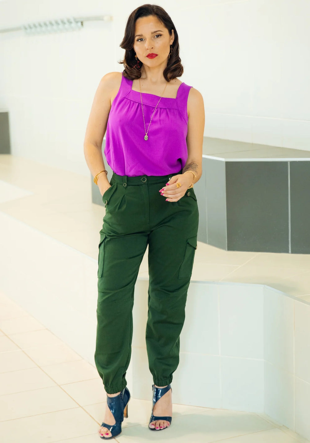 Woman wearing the Tremplin Trouser sewing pattern from Maison Fauve on The Fold Line. A cargo trouser pattern made in cotton sateen, cotton jacquard, medium weight denim, fine wool, or fine soft gabardine fabrics, featuring a tapered leg with elasticated 