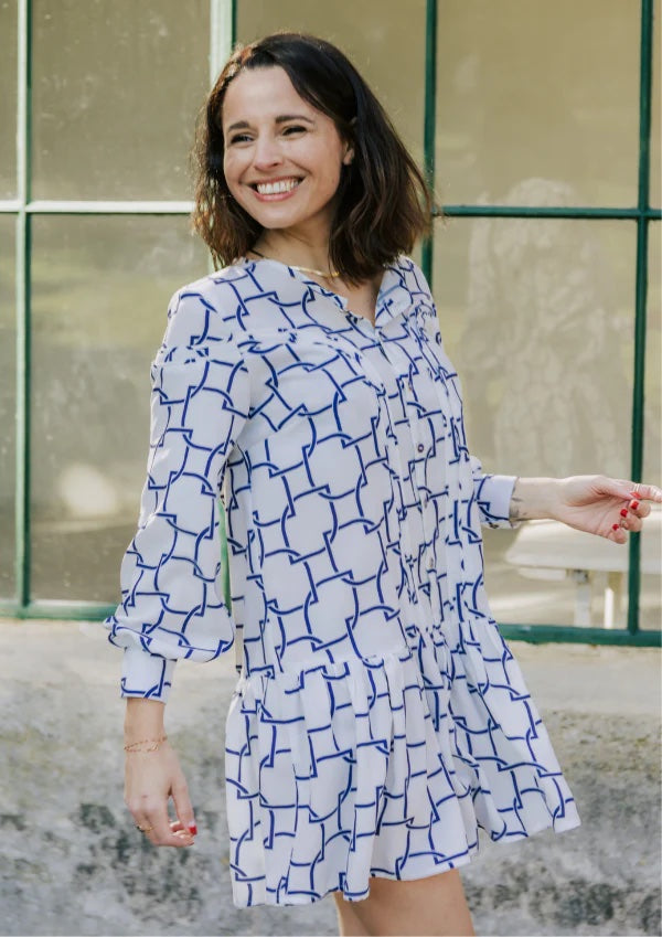 Woman wearing the Tribeca Dress sewing pattern from Maison Fauve on The Fold Line. A dress pattern made in viscose, tencel, cotton, crepe, poplin, satin or twill fabrics, featuring a semi-fit, front button closure, long sleeves with button cuffs, back yok