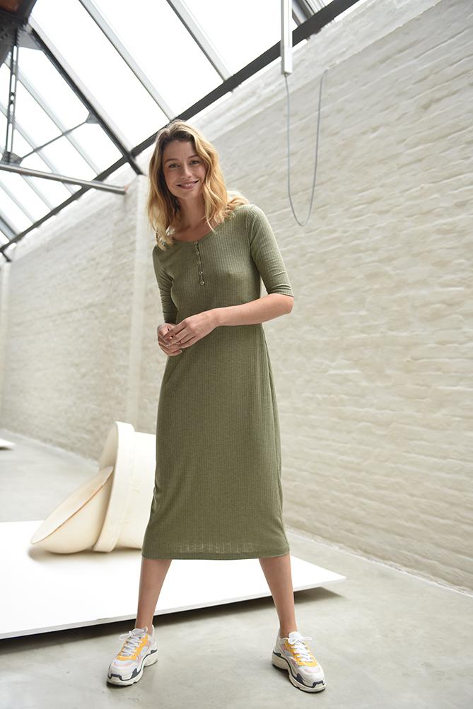 Women wearing the Trish Dress sewing pattern from Fibre Mood on The Fold Line. A semi-fitting dress pattern made in stretch knit only fabrics, featuring a midi length, scooped neckline that sits lower at the back than front, elbow length sleeves and butto