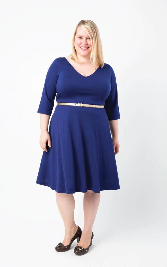 Woman wearing the Turner Dress sewing pattern by Cashmerette. A dress pattern made in knit fabric such as rayon jersey, cotton jersey, or ITY fabric featuring a flared skirt, lined V-neck bodice and ¾ sleeves.