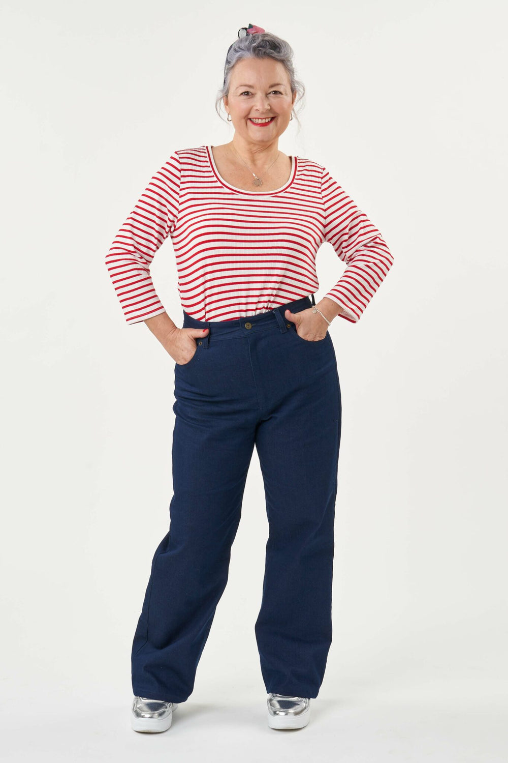 Woman wearing the Ultimate Jeans sewing pattern from Sew Over It on The Fold Line. A jeans pattern made in non-stretch denim, corduroy or twill fabrics, featuring a slightly flared leg, fly zip, back patch pockets, fronts pockets, coin pocket, belt loops 