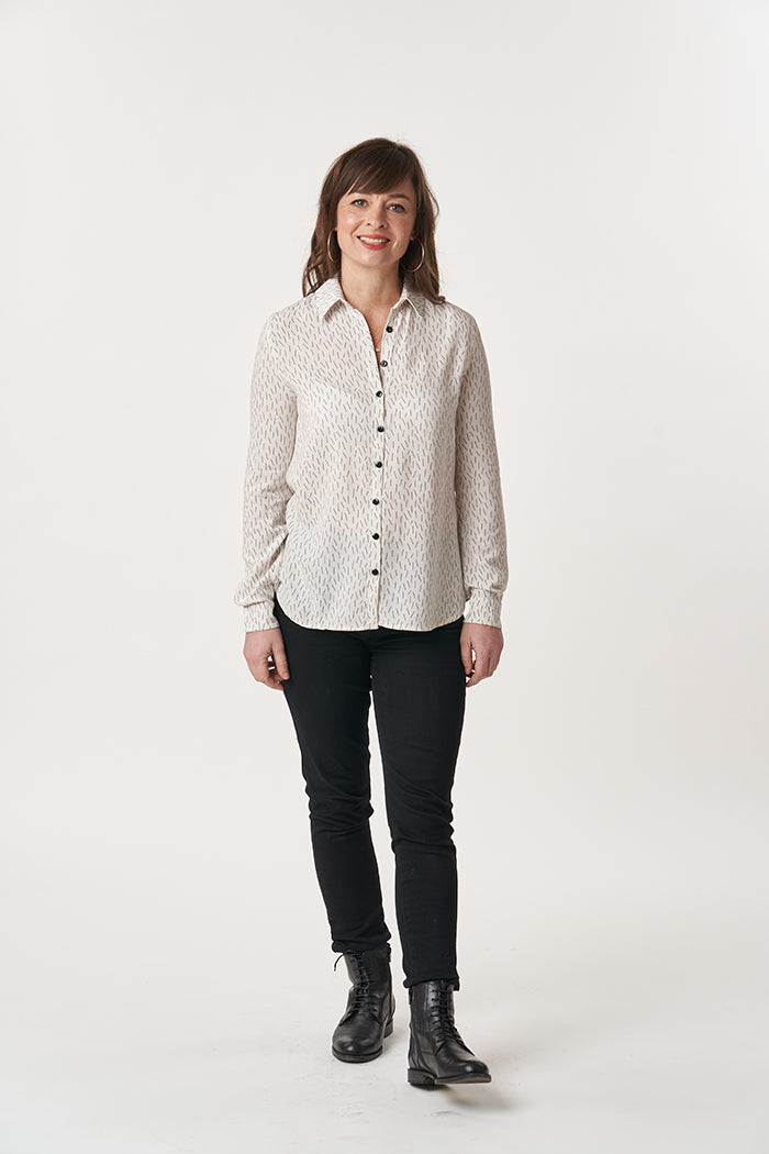 Woman wearing the Ultimate Shirt sewing pattern from Sew Over It on The Fold Line. A shirt pattern made in cotton lawn, poplin, rayon, viscose linen, or shirting fabrics, featuring a dartless bodice, collar and collar stand, back yoke with an inverted box