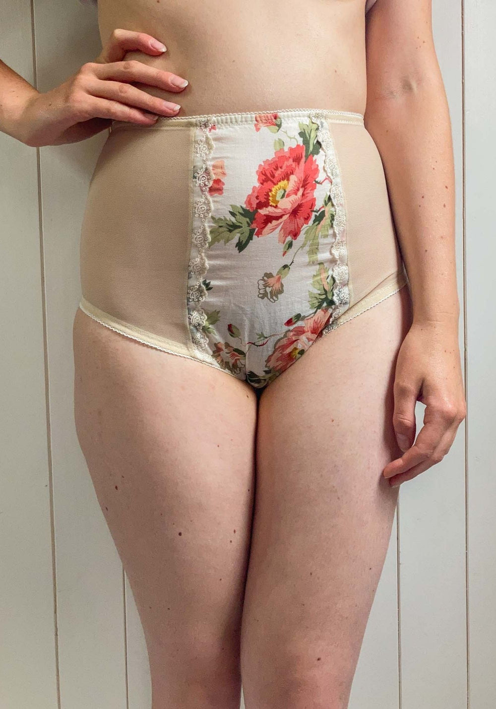 Woman wearing the Willow Knicker sewing pattern from Sew Projects on The Fold Line. A briefs pattern made in jersey, stretch satin, stretch mesh, stretch lace for the side and back. Cotton, lace, embroidery, silk, satin fabrics for the centre panel, featu
