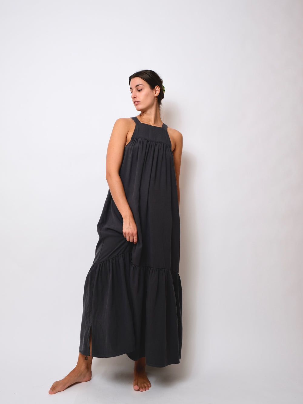 Women wearing the ZW Tier Dress sewing pattern from Birgitta Helmersson on The Fold Line. A dress pattern made in cotton, linen, silk or viscose fabrics, featuring thin shoulder straps, square neck, above-the-bust self-lined panel, A-line shape, gathered 