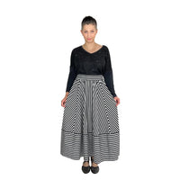 Woman wearing the Ziggy Skirt sewing pattern from Dhurata Davies Patterns on The Fold Line. A three-quarter circle skirt designed for stripy fabric.