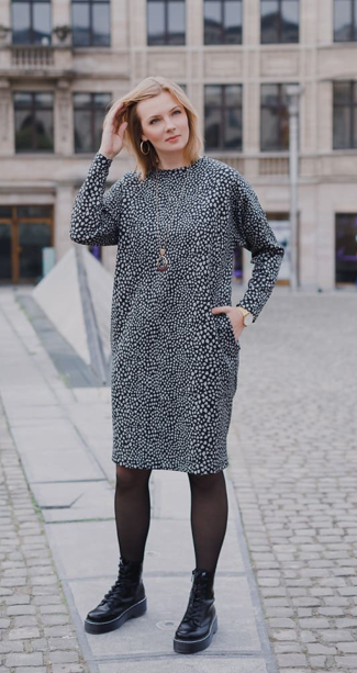 Woman wearing the Alex Dress sewing pattern from Lenaline Patterns on The Fold Line. A dress pattern made in stretch fabrics such as mesh, sweat, fleece sweat, fleece jersey or neoprene fabrics, featuring dropped shoulders with full length sleeves, round 