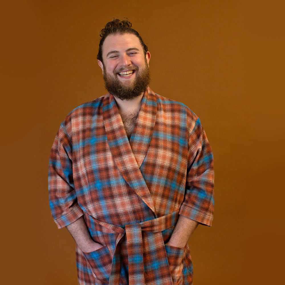 Man wearing the Unisex Arbutus Robe sewing pattern from Helen's Closet on The Fold Line. A dressing gown/robe pattern made in linen, cottons, silk, wool, hemp, rayon/viscose challis, satin, Tencel, terry cloth, waffle, velour, and fleece fabrics, featurin