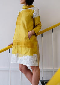 Woman wearing the Artista Dress sewing pattern from Sew Different on The Fold Line. A shift dress pattern made in denim, cotton, corduroy, linen, double knit or scuba, fabrics, featuring an A-line silhouette, large in seam pockets, dropped shoulders, inse