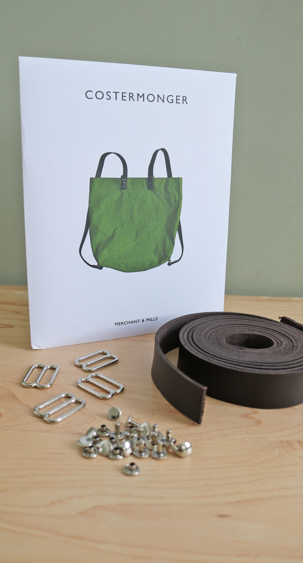 Photo showing the Merchant & Mills Costermonger Pattern and Hardware Kit Bundle. A fun and practical sewing project for any enthusiastic maker, and this bundle includes the sewing pattern plus all the hardware you need. A perfect gift or Christmas present