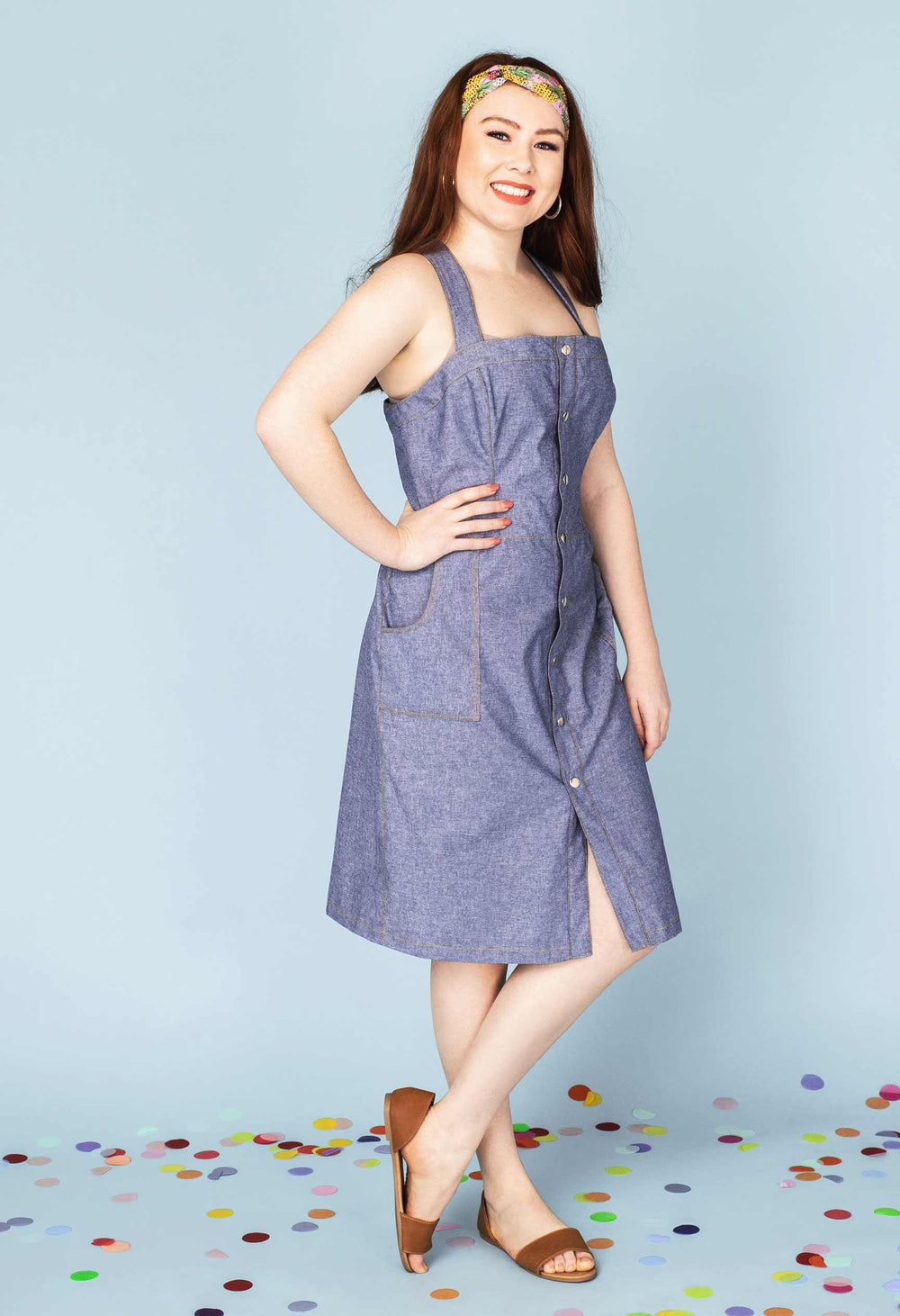 Woman wearing the Daiquiri Dress sewing pattern from Our Lady of Leisure on The Fold Line. A dress pattern made in denims, twill, duck, corduroy, chino, cotton, linen or tencel fabrics, featuring a fitted silhouette, princess-seamed bodice, centre front b