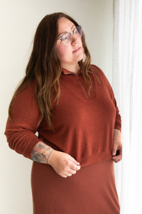 Woman wearing the Hive Pullover sewing pattern from Allie Olson on The Fold Line. A top pattern made in French terry, sweatshirt fleece, or sweater knit fabric, featuring a boxy fit, dropped shoulders, angled front yoke with a centre front zipper, cuffed 