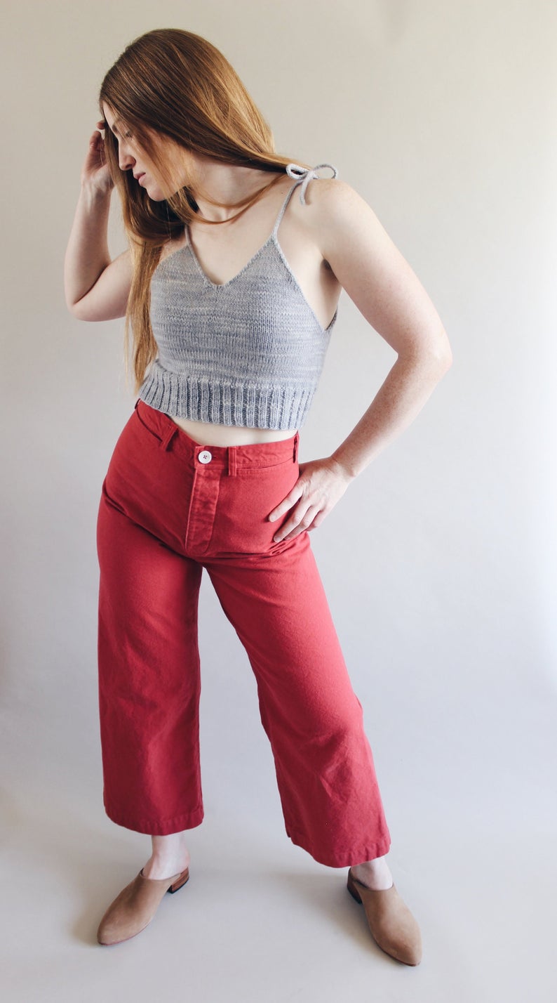 Woman wearing the Persephone Pants sewing pattern by Anna Allen. A trouser pattern made in cotton canvas, twill, cotton denim or drill fabrics, featuring a high waist, concealed button fly, in-seam pockets, and belt loops.