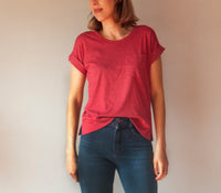 Woman wearing the Astair Tee sewing pattern by French Navy. A T-shirt pattern made in light to medium weight knit fabrics with moderate (20-40%) stretch, featuring a boxy silhouette, dropped shoulders, split hem, patch pocket and short sleeves.