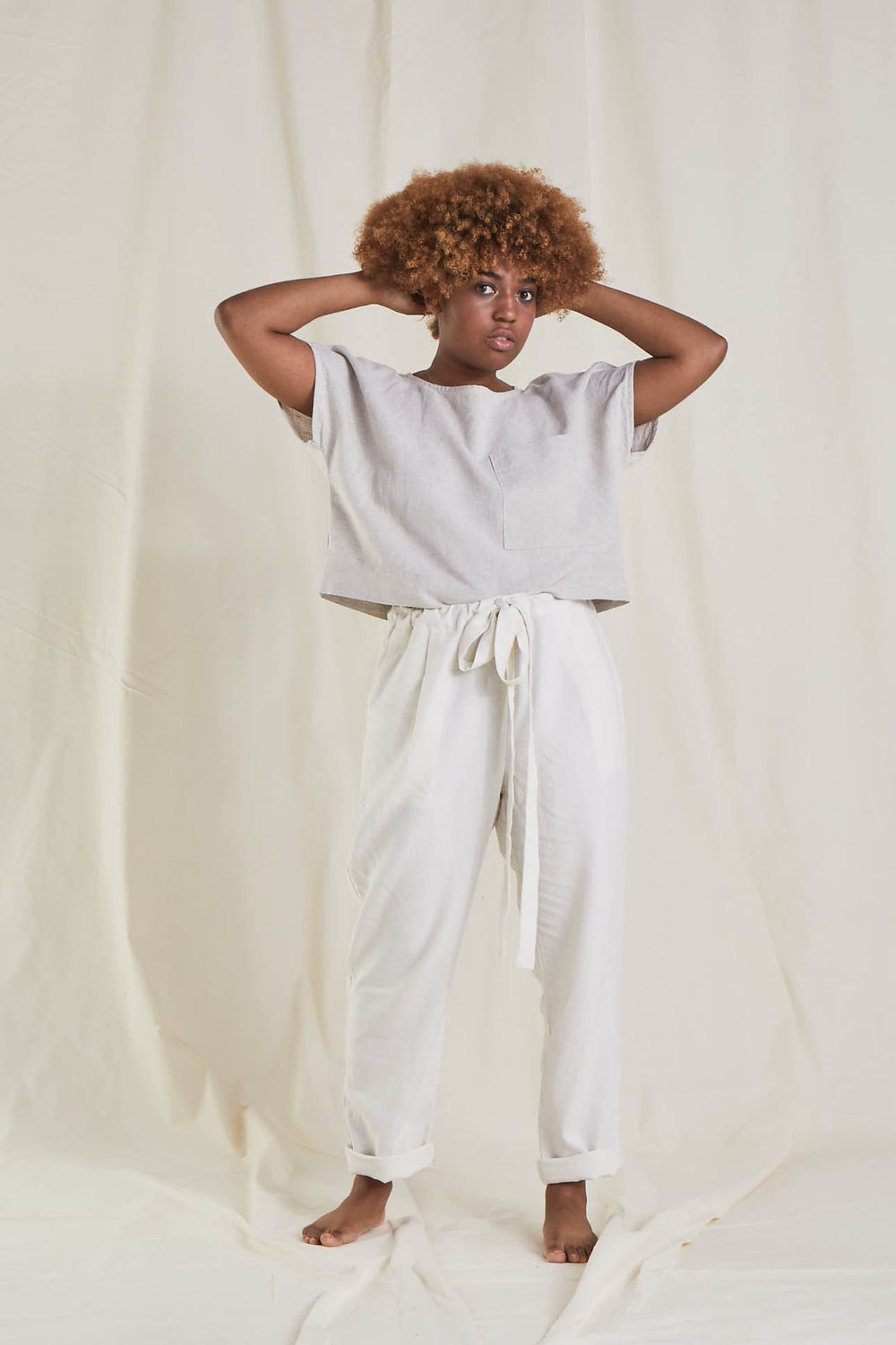 Women wearing the Miller Trousers sewing pattern from Paper Theory Patterns on The Fold Line. A trouser pattern made in cotton, linen, drill, canvas, lightweight denim, wool crepe or viscose twill fabrics, featuring a relaxed fit, drawstring waist, high w