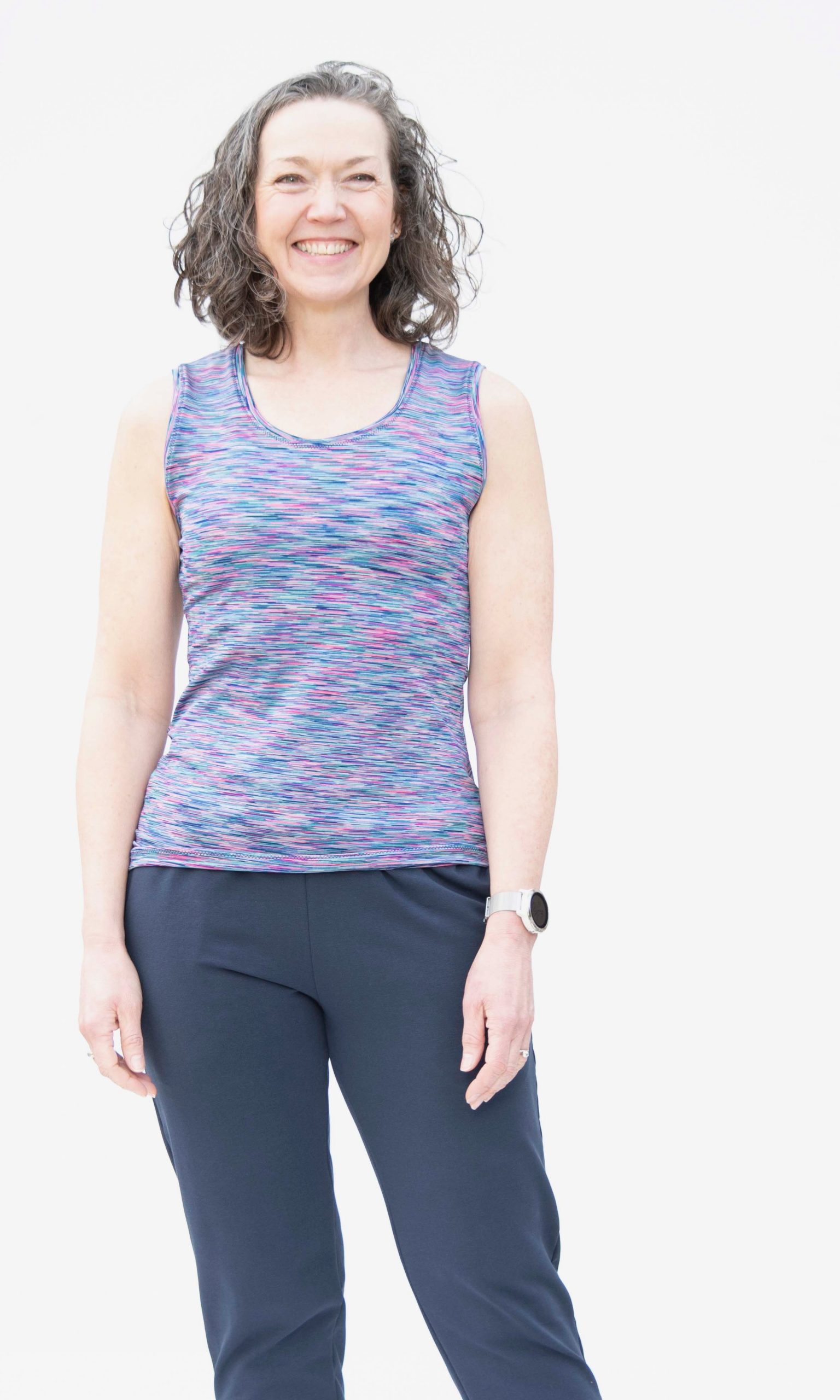 Women wearing the Karen Vast Top sewing pattern from Bobbins and Buttons on The Fold Line. A vest top pattern made in 4-way stretch fabrics, featuring a fitted silhouette, scoop neck, wide shoulder straps, hip length and racer back.