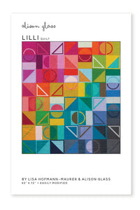 Photo showing the Lilli Quilt sewing pattern from Alison Glass on The Fold Line. A quilt pattern made in quilting cotton fabrics, featuring a design of squares, circles, arcs, and triangles in a rainbow of colours.