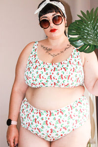 Woman wearing the Pink Lady Bikini sewing pattern from Fitiyoo on The Fold Line. A bikini pattern made in two-way stretch fabrics, featuring high waist briefs and secure fitting bra.