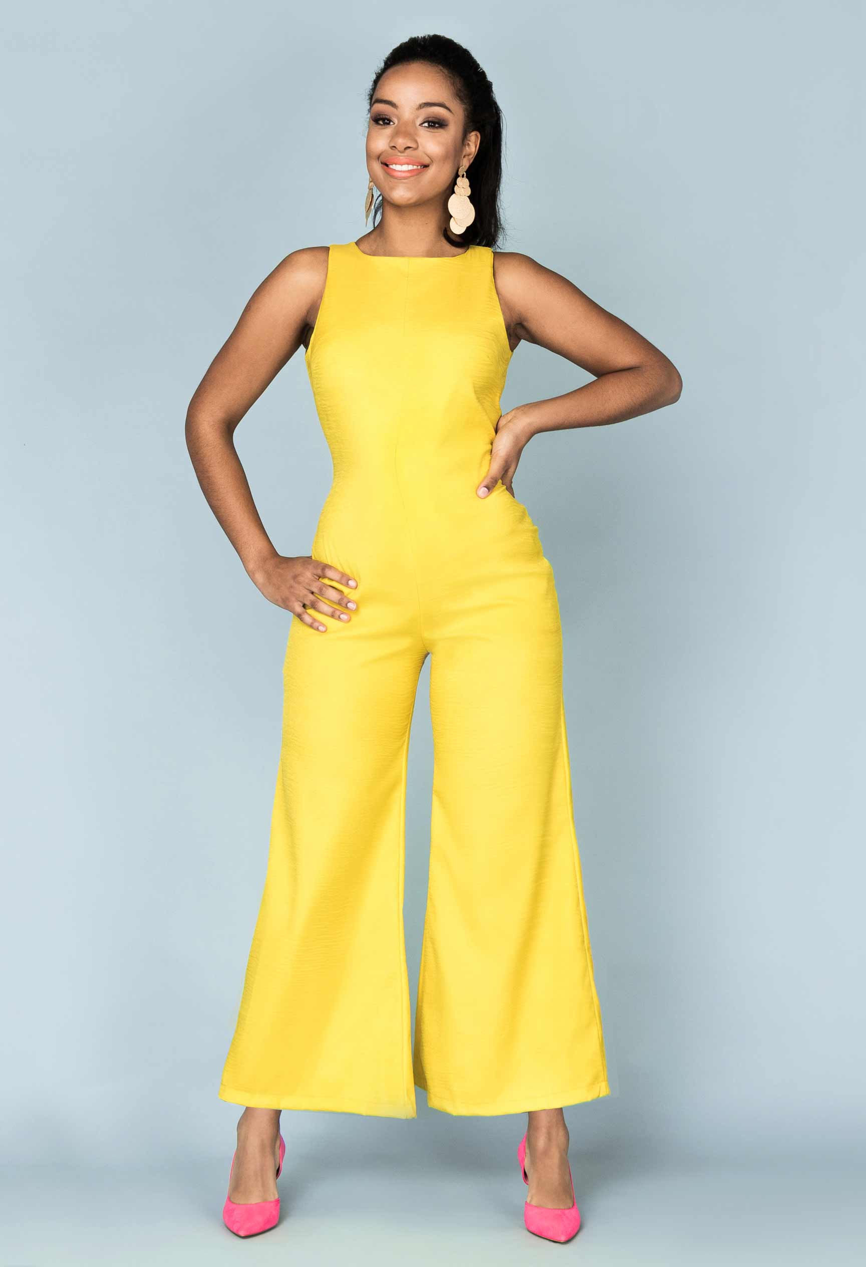 Woman wearing the Paloma Jumpsuit sewing pattern from Our Lady of Leisure on The Fold Line. A jumpsuit pattern made in faille, challis, crepe or light cotton fabrics, featuring an invisible back zip, sleeveless, ankle length, wide leg, bust darts, close f