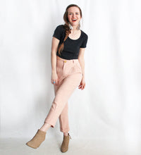 Woman wearing the Nita Trousers sewing pattern by Amy Nicole. A trouser pattern made in light to medium weight fabrics such as tencel twill, silk noil, linen and medium weight cotton fabrics, featuring a high-waist, slash front pockets, cropped length and