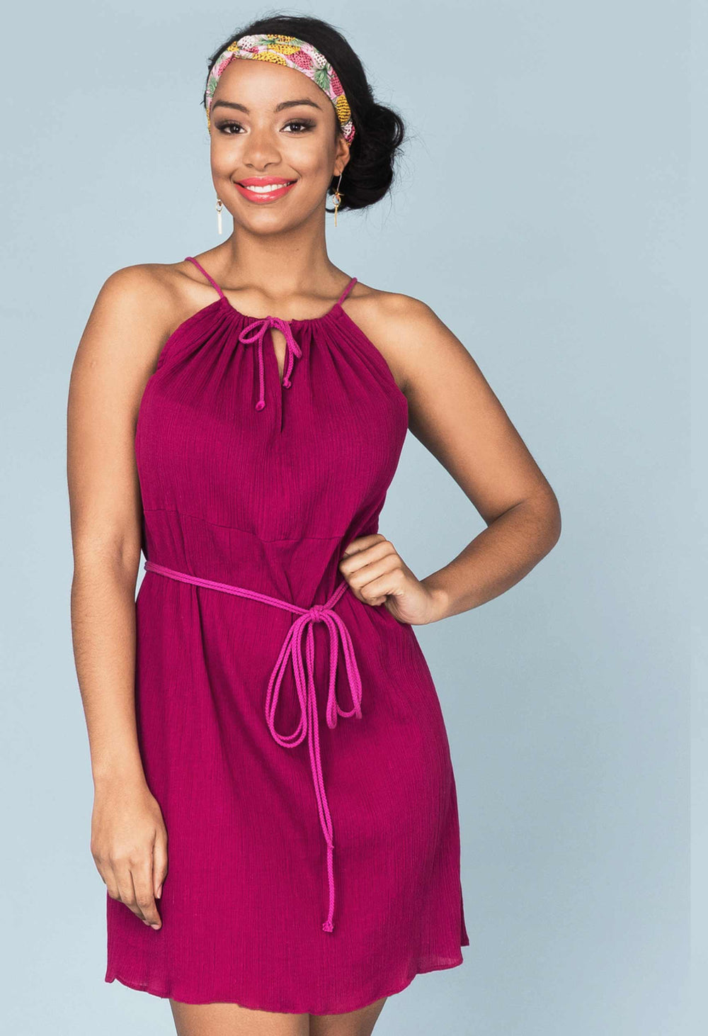 Woman wearing the Spritz Dress sewing pattern from Our Lady of Leisure on The Fold Line. A dress pattern made in cheesecloth, voile, gauze, cotton, linen, rayon or polyester fabrics, featuring a relaxed fit, mini length, gathered front and back bodice wit