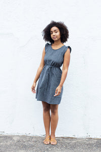 Woman wearing the Montavilla Dress sewing pattern from Sew House Seven on The Fold Line. A sleeveless dress pattern made in challis, sandwashed silk, Tencel, linen, lawn, lightweight shirting or cotton ikat fabrics, featuring front patch pockets, scoop ne