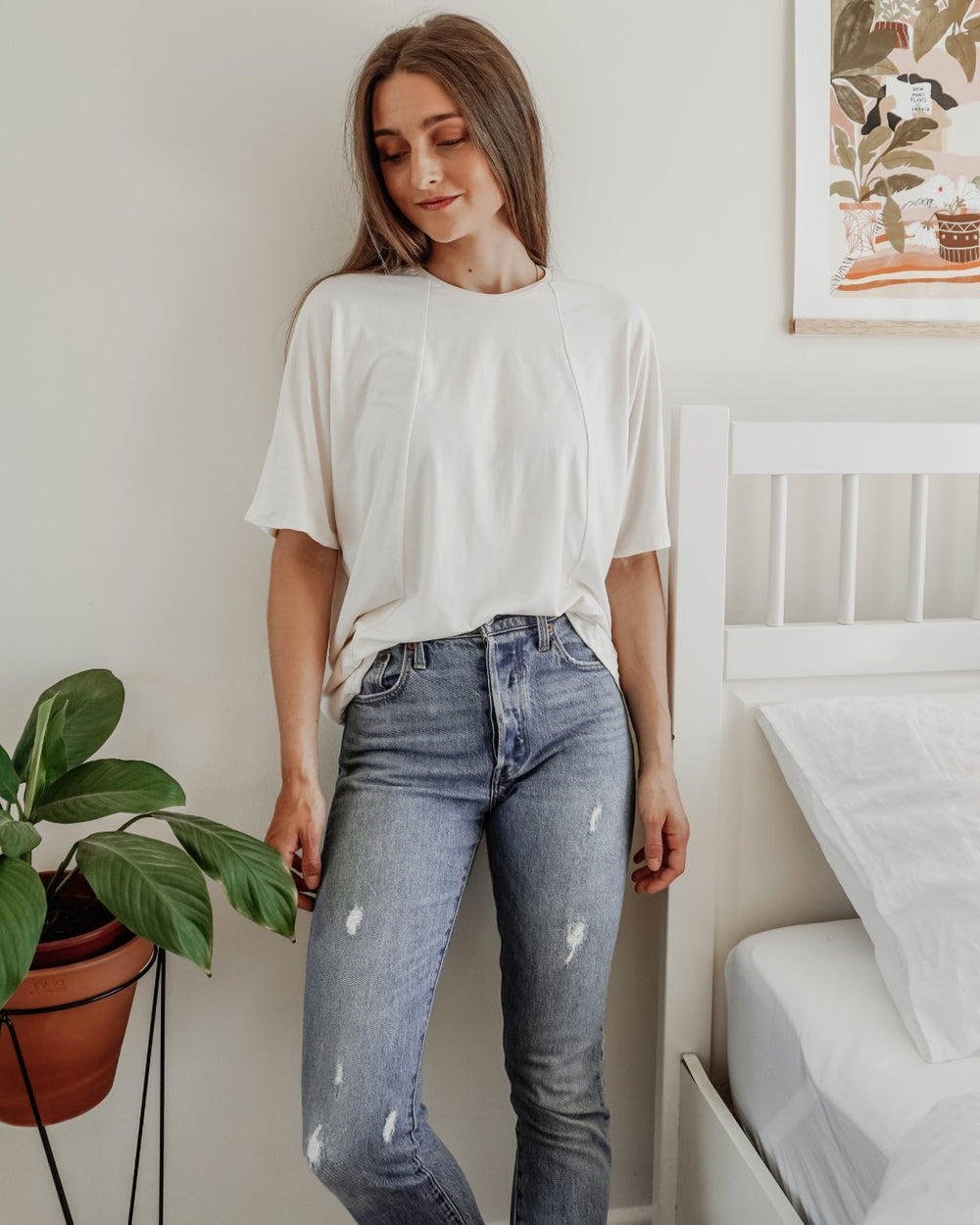 Woman wearing the Unisex Tulia Tee sewing pattern from Sewing Patterns by Masin on The Fold Line. A T-shirt pattern made in cotton jersey, viscose jersey or merino wool jersey fabrics, featuring an oversized fit, round neck, grown-on elbow length sleeves 