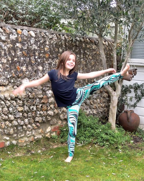 Child wearing the Children's Moov Leggings sewing pattern by Dhurata Davies Patterns. A leggings pattern made in light to medium weight jersey fabric with at least 30% stretch and good recovery, featuring an elasticated waist and snug but comfortable fit.