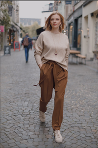 Woman wearing the Viktor Trousers sewing pattern from Lenaline Patterns on The Fold Line. A trouser pattern made in wool suiting, velvet, corduroy, linen, denim, chambray, cotton twill, tartan or gabardine fabrics, featuring a high waist, belt and belt lo