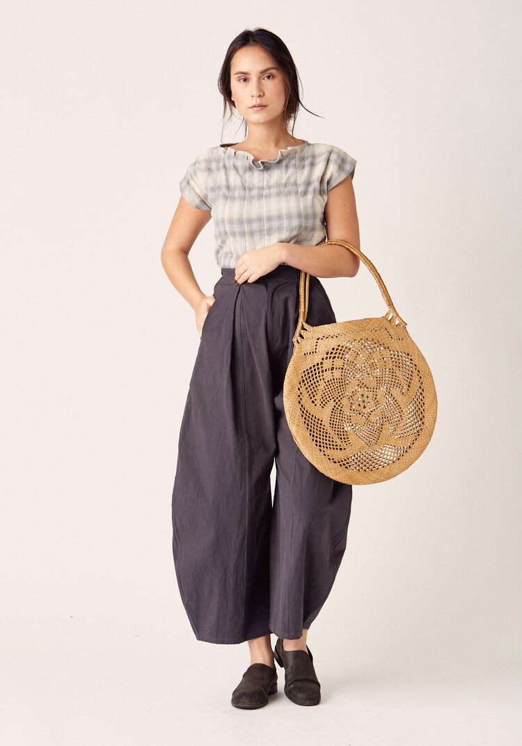 Woman wearing the Arthur Pants sewing pattern by Sew Liberated. A trouser pattern made in linen, gabardine, silk noil, twill, cotton chambray, French terry, interlock or jersey fabrics, featuring wide-legs with dramatically shaped side seams and a tapered