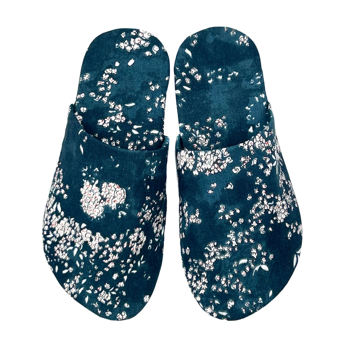 Photo of the Whisper Slippers sewing pattern from Dhurata Davies Patterns on The Fold Line. A bedroom slippers pattern made in cotton or linen fabric, featuring a closed toe and open back, perfect for using up fabric scraps.