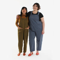 Women wearing the Yanta Overalls sewing pattern by Helens closet. A dungaree pattern made in cotton, twill, denim, or linen featuring a v-shaped back, button-fastening straps and pointed pocket.