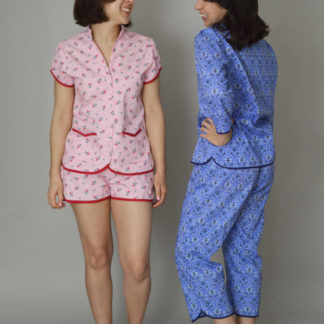 Women wearing the Piccadilly Pyjamas sewing pattern from Nina Lee on The Fold Line. A PJ pattern made in cotton lawn, rayon or silk satin fabrics, featuring long or short length trousers, elasticated back waistband with flat front, 3/4 or cap sleeves, stand collar, front button closure and patch pockets.