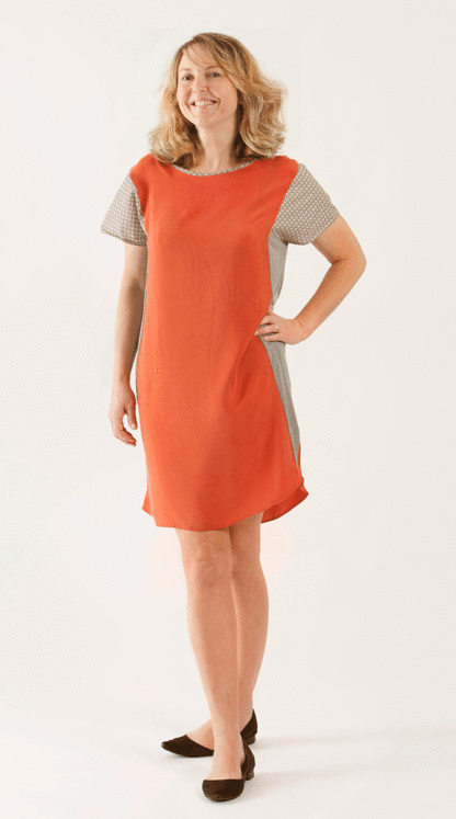 Woman wearing the Panel Dress and Tee sewing pattern from Sew Different on The Fold Line. A shift dress pattern made in viscose, polycotton, silk, jersey, chiffon or crepe fabrics, featuring a loose fit, cap sleeves, boat neckline and curved hemline.