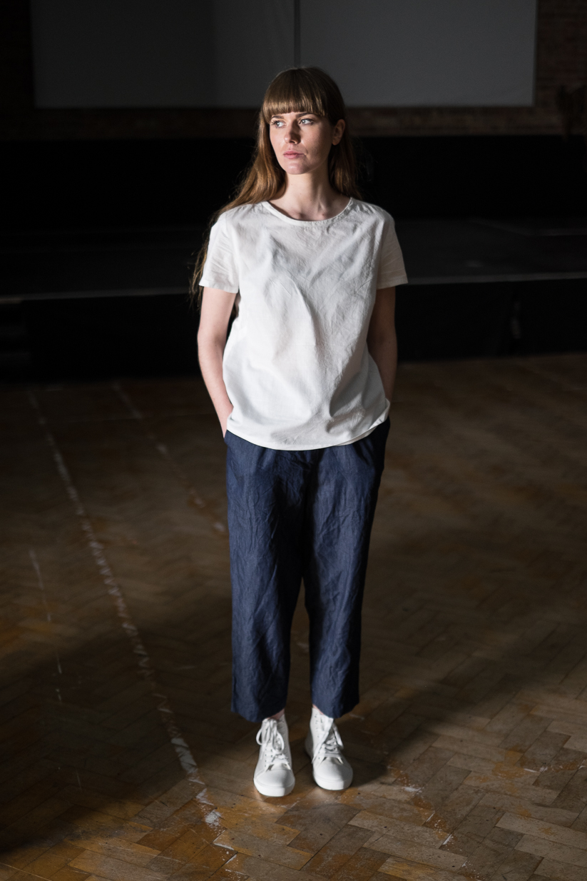 Woman wearing the 101 Trouser sewing pattern by Merchant and Mills. A trouser pattern made in linen, soft cottons, fine wool or crepe fabric featuring a drawstring waist, side pockets, and false fly.