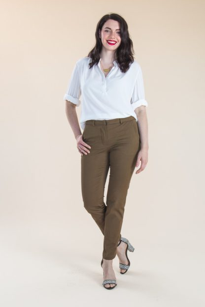 Woman wearing the Sasha Trousers sewing pattern by Closet Core Patterns. A trouser pattern made in stretch denim, twill, suiting or gabardine fabric featuring a flattering mid-rise, contour waistband, slim tapered legs and slashed hip pockets.
